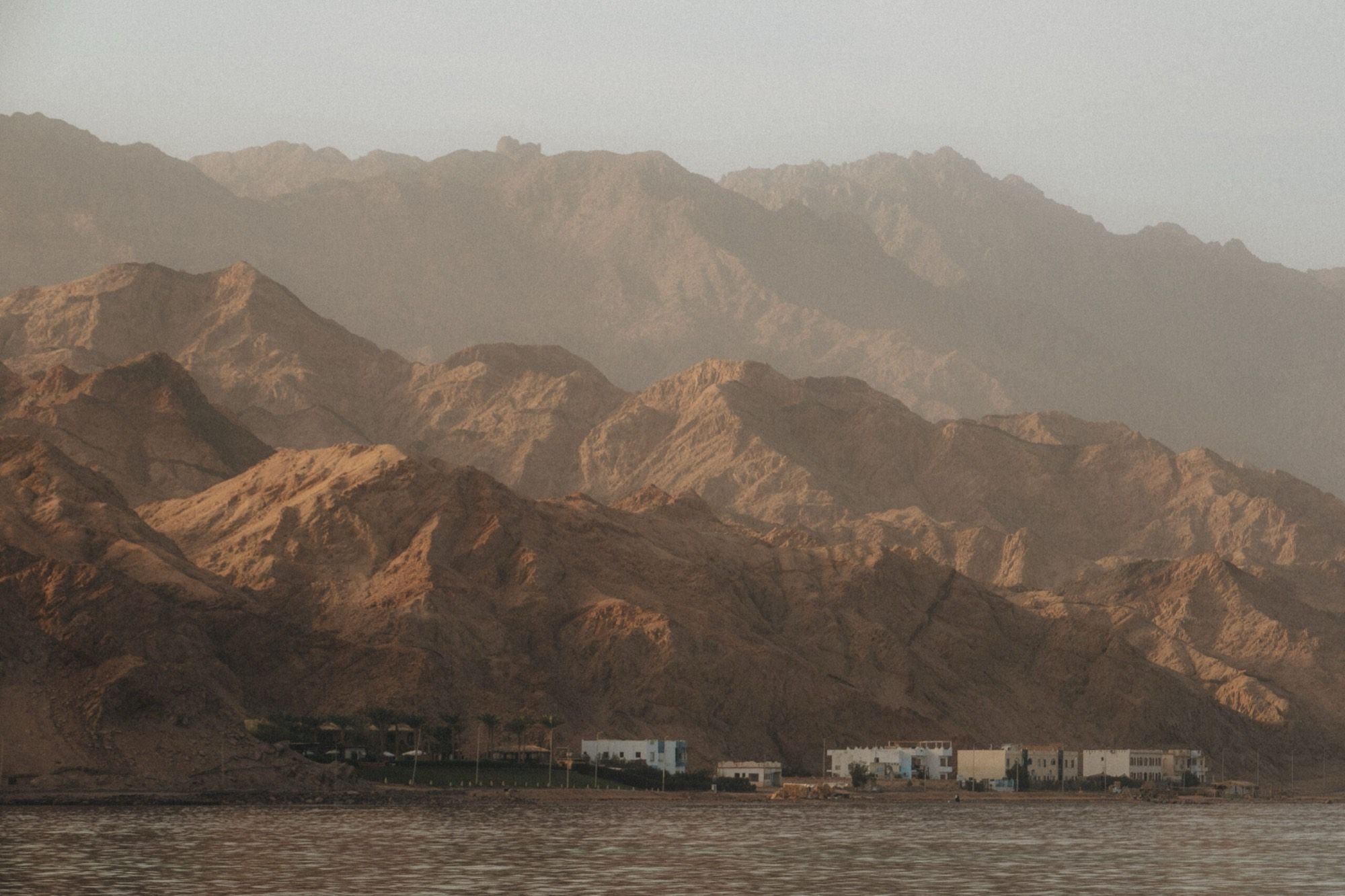 The calm bay of Dahab with the mountains of Sinai behind it