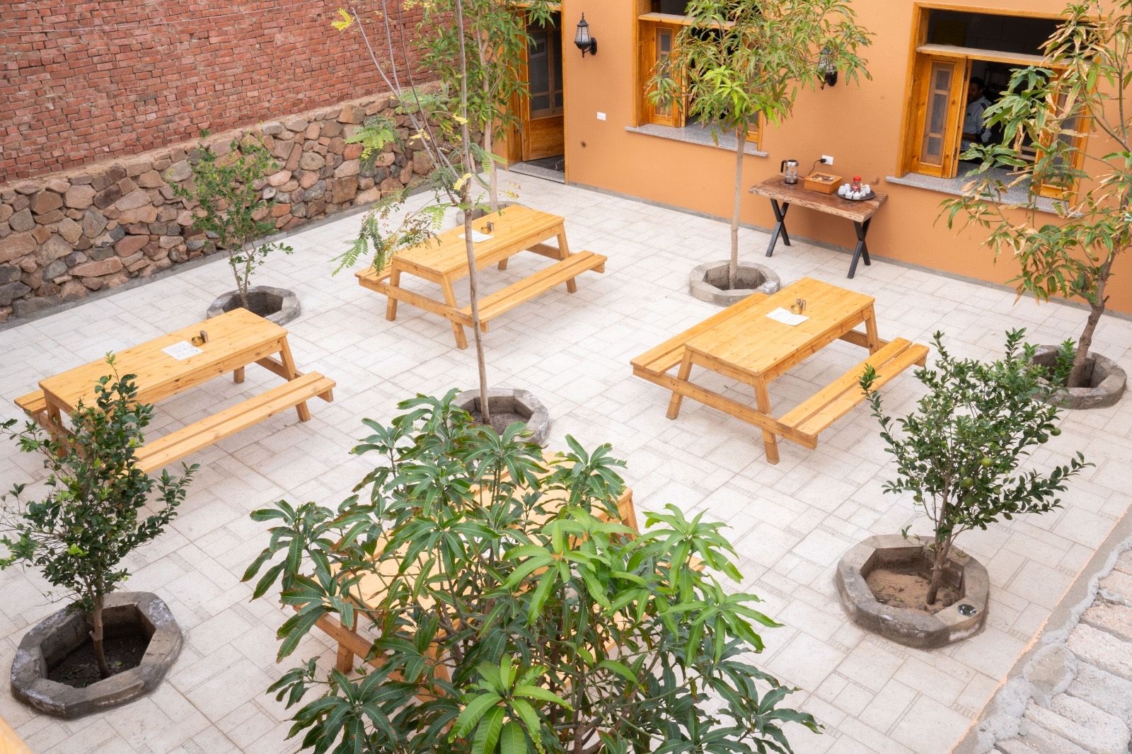The shared courtyard and breakfast area at The Gate Hotel