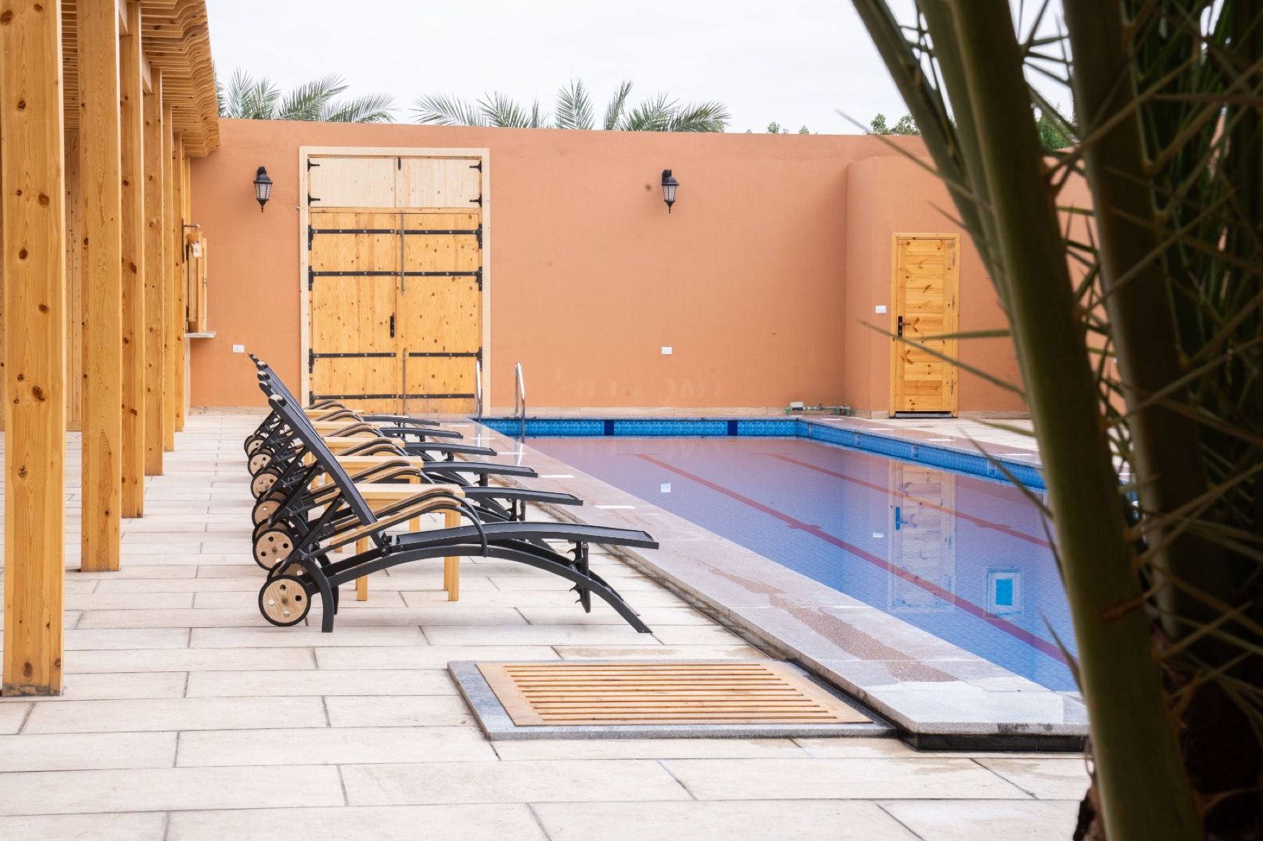 The 25m pool at The Gate Hotel with loungers
