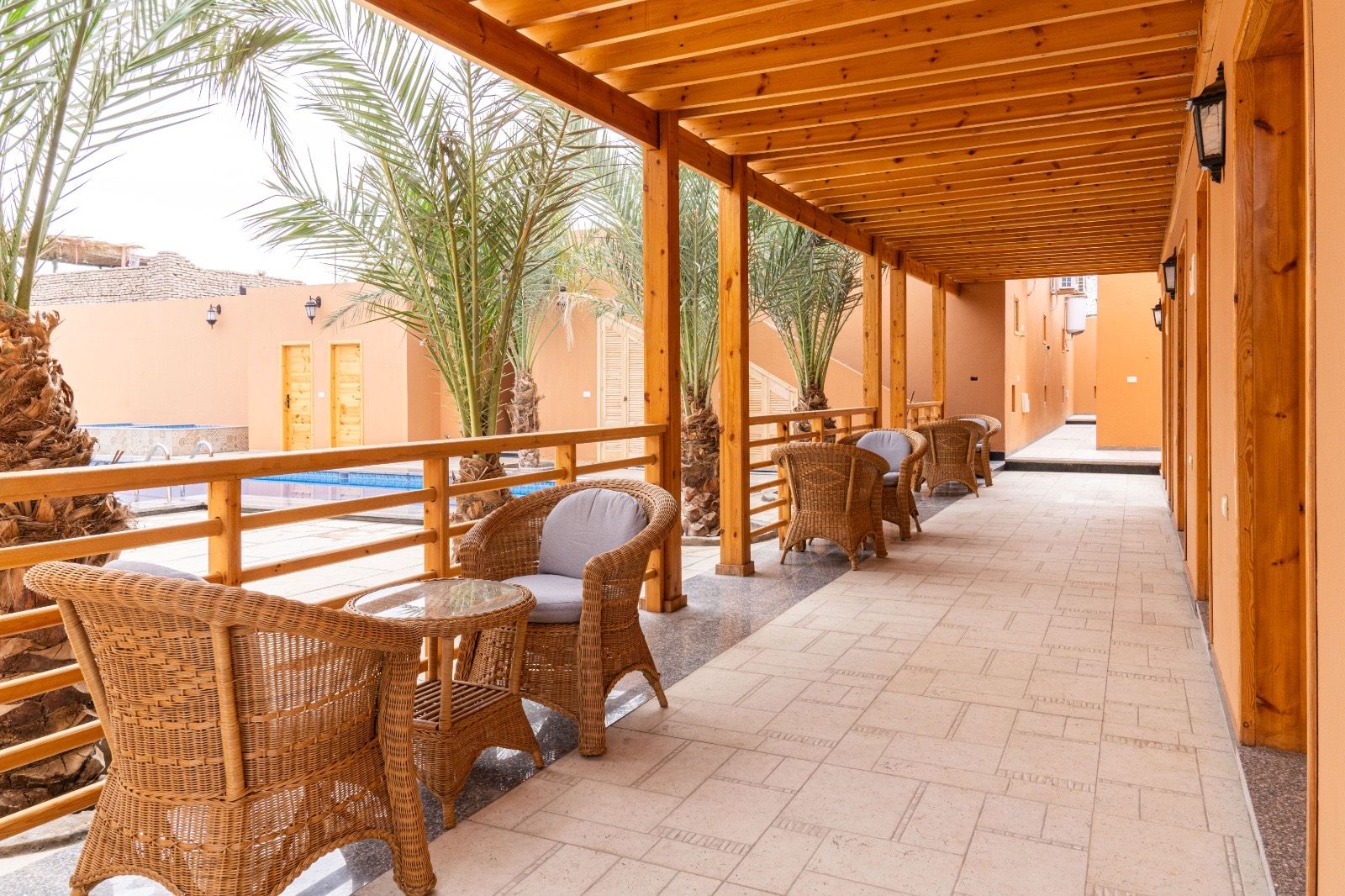 The covered terrace by the pool at The Gate Hotel